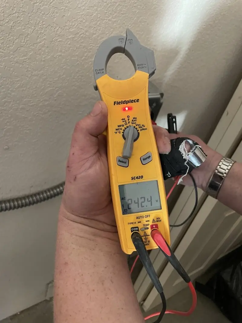 Voltage testing with clamp meter during Electrical Installation Services in Lakeland North